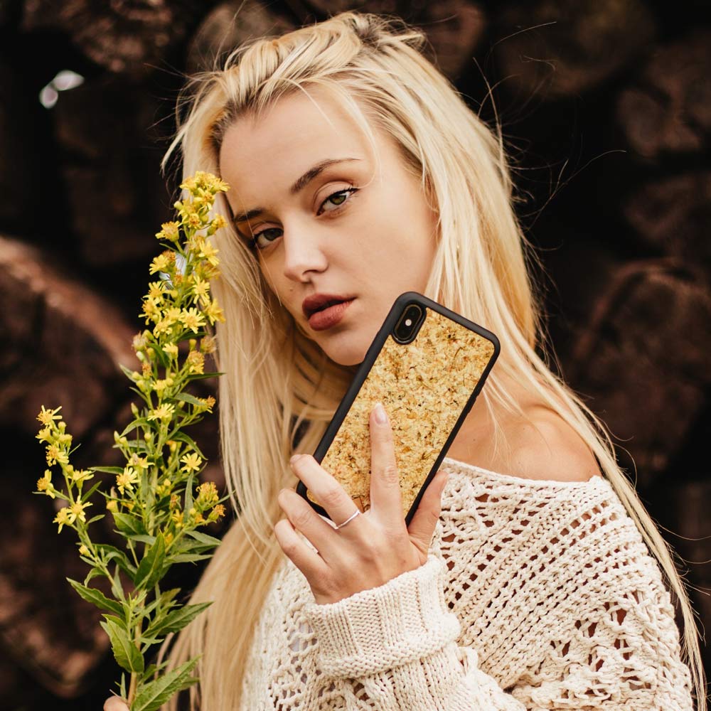 Sustainable handmade phone case with organic jasmine petals encased in clear biodegradable material, black edges, for.