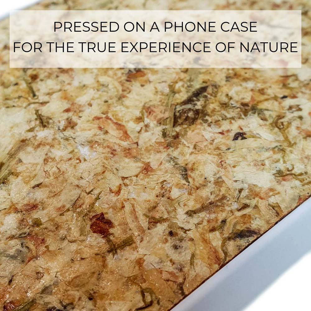 Close-up of eco-friendly, organic, handmade phone case surface with natural pressed jasmine flowers embedded, showcasing.